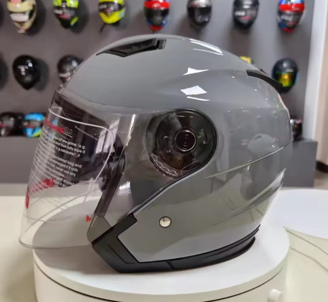 Motorcycle helmet half face with retractable sun visor